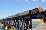 Vehicle train crosses over the bridge